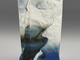 a blue and white vase with a whale on it