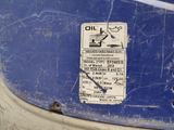a sign on the side of a blue vehicle