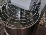 a box sitting on top of a mixer in a kitchen