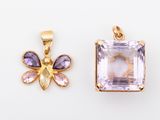 two amethorate and amethorate pendants on a white background