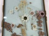 a picture of a picture of flowers in a glass frame