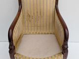 an image of a chair with a striped upholstered back and arms