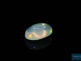 an oplite is shown in the dark on a black surface
