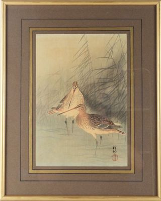 tableau représentant un oiseau volant au-dessus d'un plan d'eau, dans un cadre