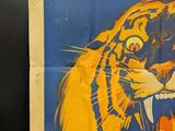 a poster with a tiger on it on the wall