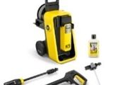 a yellow and black pressurer and cleaning kit with a bottle of cleaner