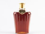 an image of a bottle of liquor sitting on a white surface