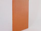 an orange leather notebook with a blank page on a white background