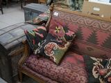 an image of a living room with a couch and suitcases
