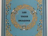 the cover of the book les troiss dragons is shown in gold and blue