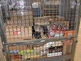 a metal cage filled with boxes of food on the floor