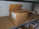 a box that is sitting on a shelf in a room
