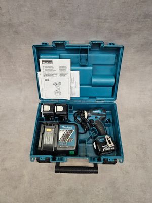 a blue tool box with a drill and a hammer inside of it