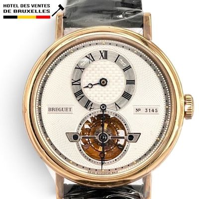 an image of a close up of a wrist watch with roman numerals