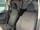 the interior of a car with a dog cage in the back of it