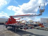 a red crane that is sitting in the back of a truck