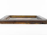 a close up of a wooden tray on a white surface