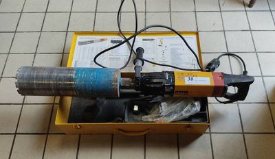 a box that has a drill in it on the floor
