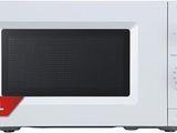 the microwave is white and has a black dial on it