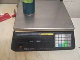an image of a scale with a can of soda on top of it