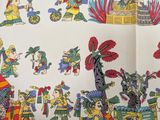 an image of a table cloth with a picture of people on it