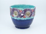 a blue bowl with a design on the inside of it