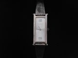 a close up of a wrist watch on a black surface