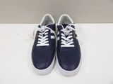 navy blue and white sneakers with white laces on a white surface