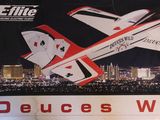 a poster of a plane flying over a city at night