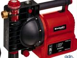 a red and black pump with a hose attached to it