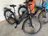 two bikes parked next to each other in a garage
