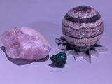 two rocks and a rock on a white surface