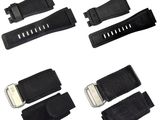 a close up of a group of black straps on a white background