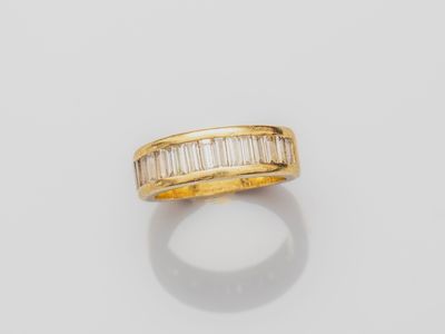 an 18k gold ring with baguets of diamonds