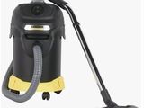 un aspirateur noir et jaune muni d'un tuyau jaune