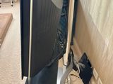 a television that is sitting on a stand in the corner of a room