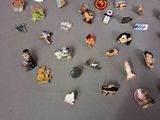 a lot of pins that are on a table