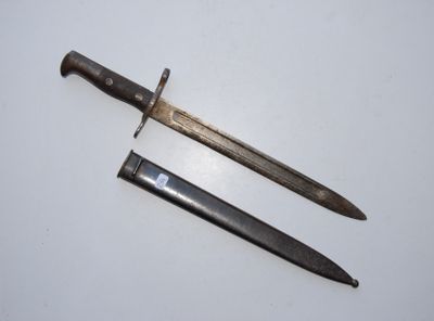 two old knives are laying on a white surface
