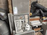 a pile of assorted metal items in a room