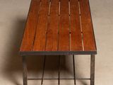 a wooden table with metal legs and a wooden table top