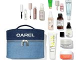 the contents of a travel bag are laid out on a white surface