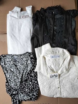 three pieces of clothing sitting on top of a cardboard box