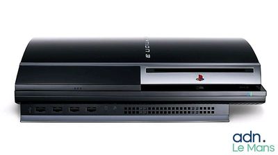 the sony playstation is sitting on top of a white surface