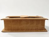 an image of a brown leather box with a wooden handle