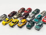 a lot of toy cars that are lined up together