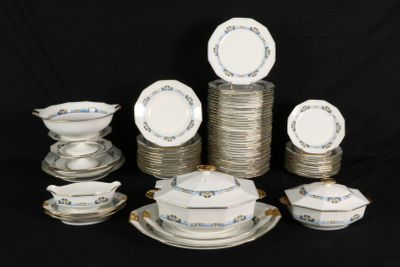 a lot of plates and bowls on the table