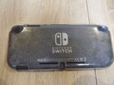 the nintendo switch case is sitting on top of a wooden table