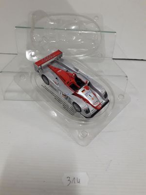 a plastic box with a toy car inside of it