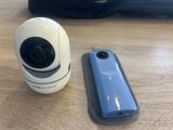 a camera that is sitting next to a cell phone