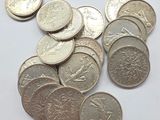 a lot of coins that are on the table